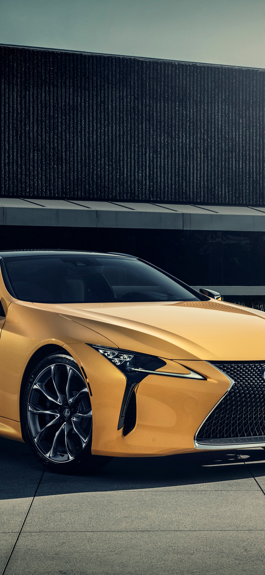 Yellow Lamborghini Aventador Parked on Parking Lot During Daytime. Wallpaper in 1125x2436 Resolution