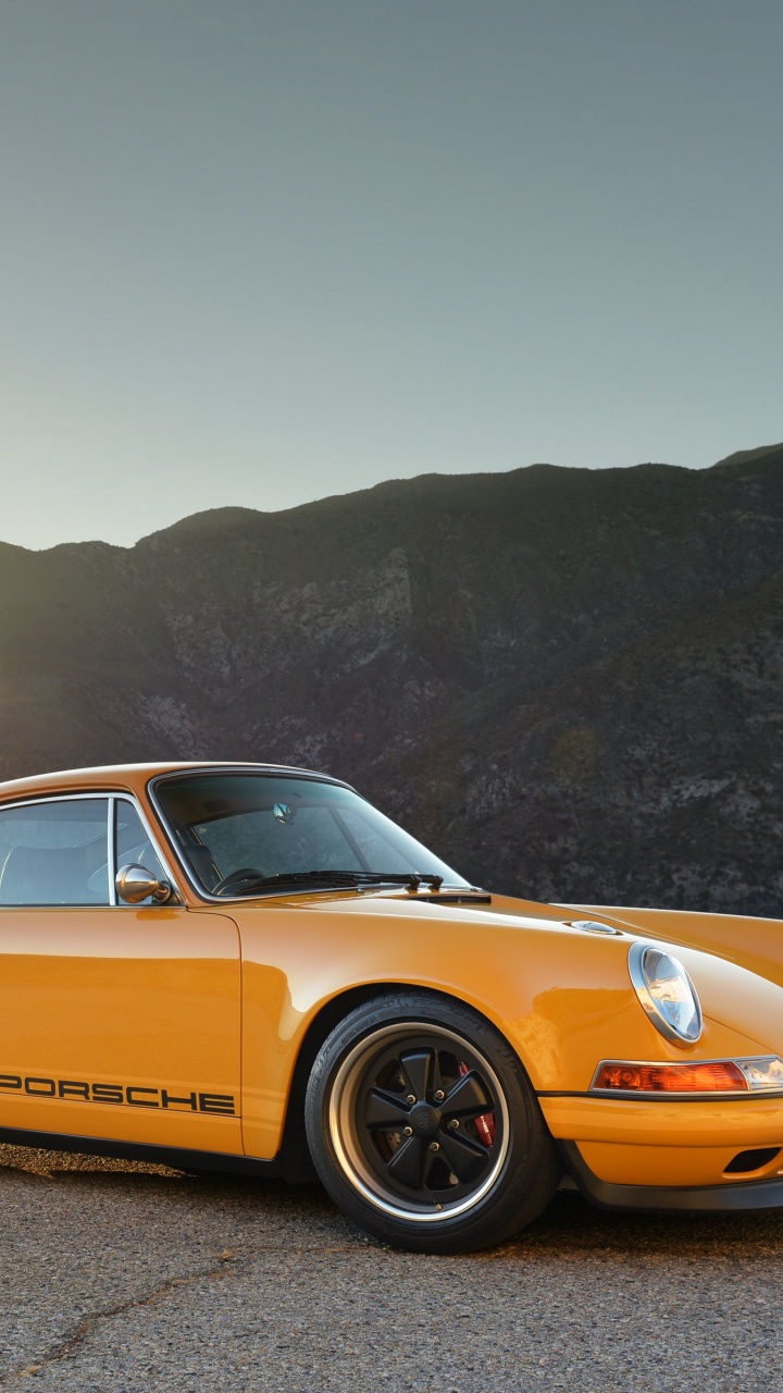 Yellow Porsche 911 on Brown Dirt Road During Daytime. Wallpaper in 720x1280 Resolution