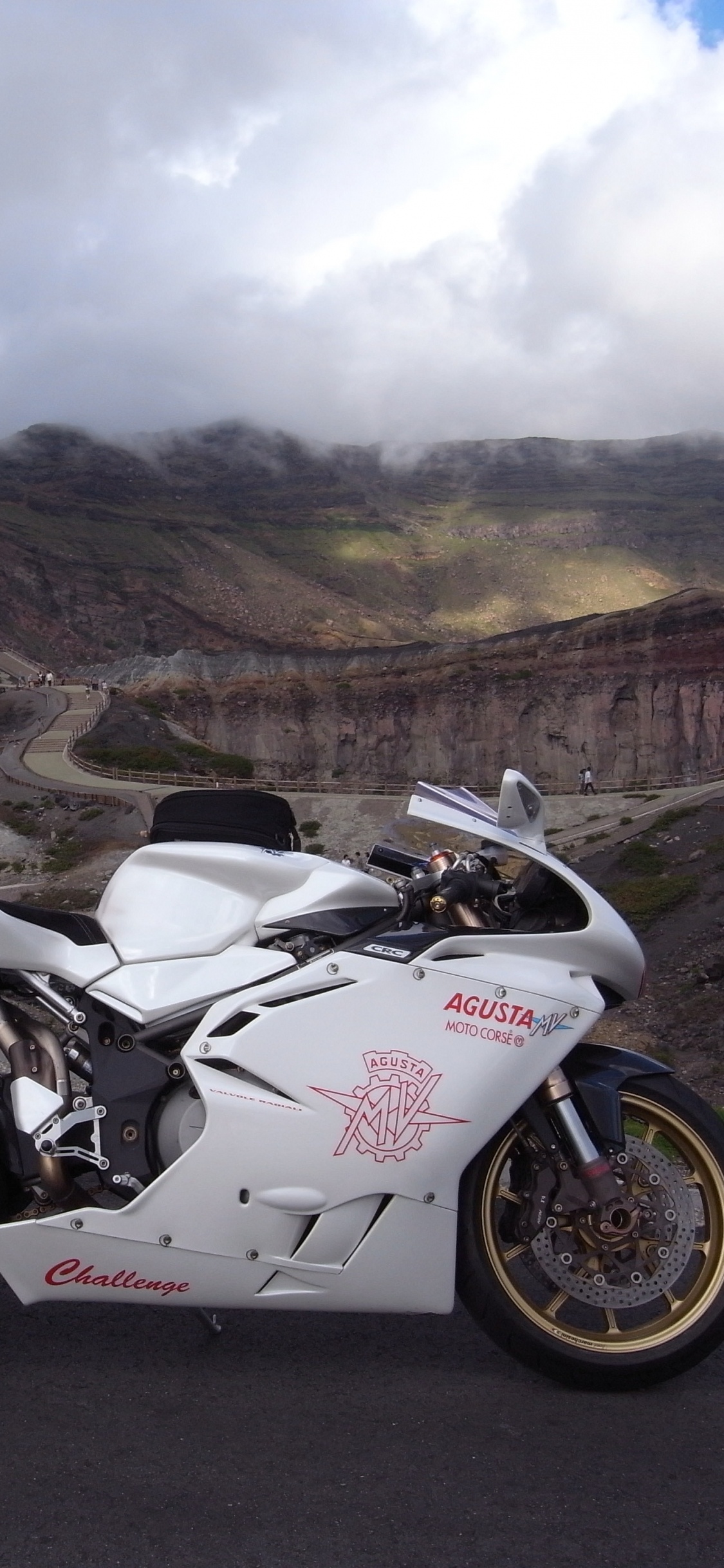 White and Black Sports Bike on Road During Daytime. Wallpaper in 1125x2436 Resolution