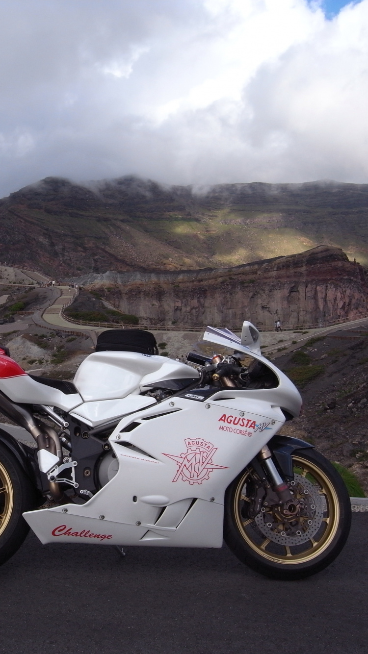 White and Black Sports Bike on Road During Daytime. Wallpaper in 750x1334 Resolution
