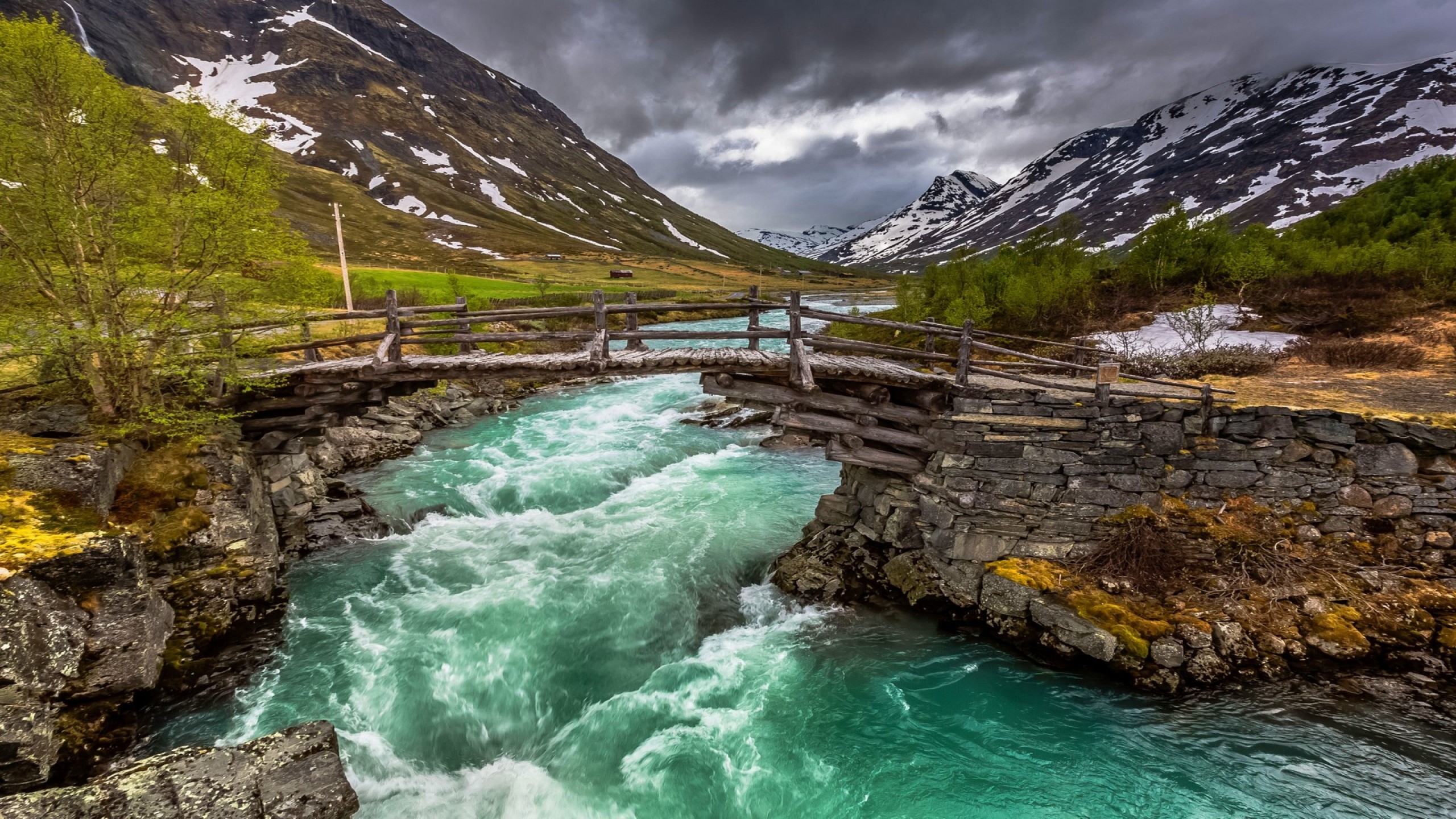 Green Lake Near Mountain Under White Clouds During Daytime. Wallpaper in 2560x1440 Resolution