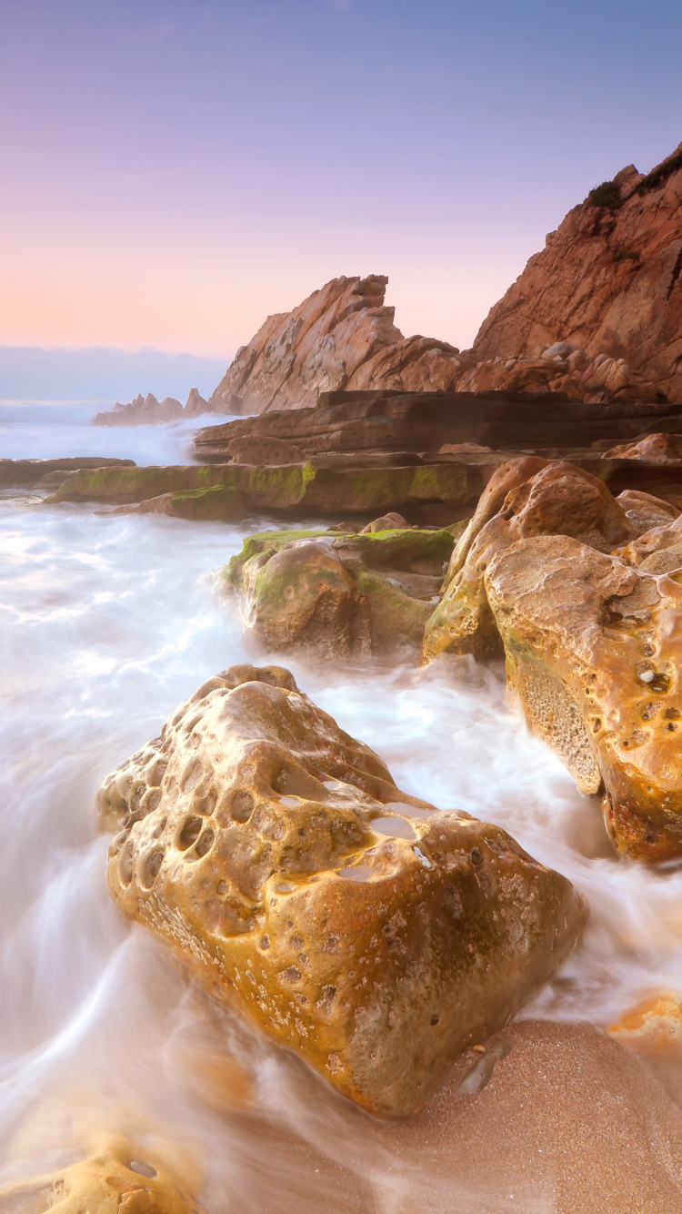 Brown Rock Formation on Sea During Daytime. Wallpaper in 750x1334 Resolution