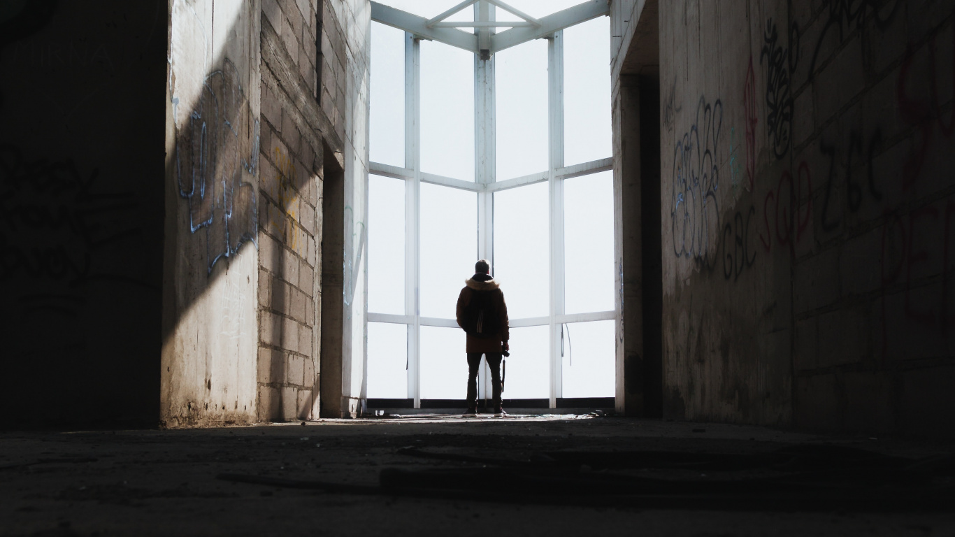 Person Walking on Hallway During Daytime. Wallpaper in 1366x768 Resolution