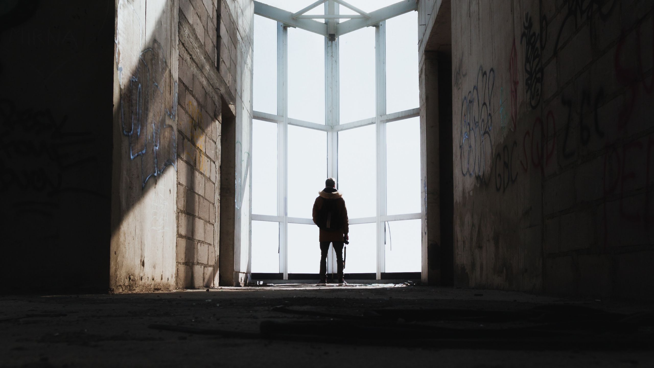 Person Walking on Hallway During Daytime. Wallpaper in 2560x1440 Resolution