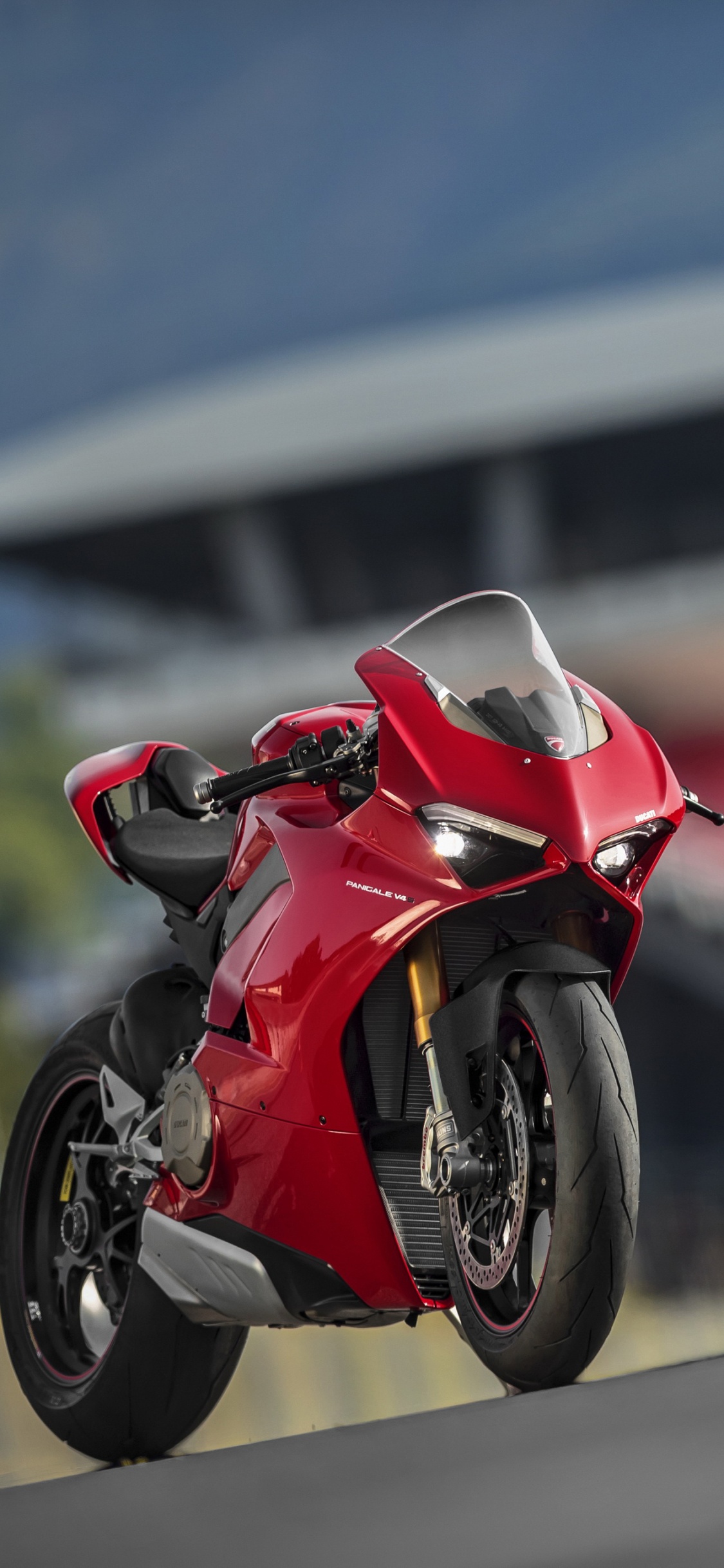 Red and Black Sports Bike Parked on The Road During Daytime. Wallpaper in 1125x2436 Resolution