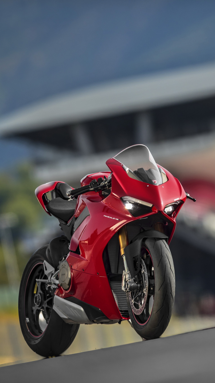 Red and Black Sports Bike Parked on The Road During Daytime. Wallpaper in 750x1334 Resolution