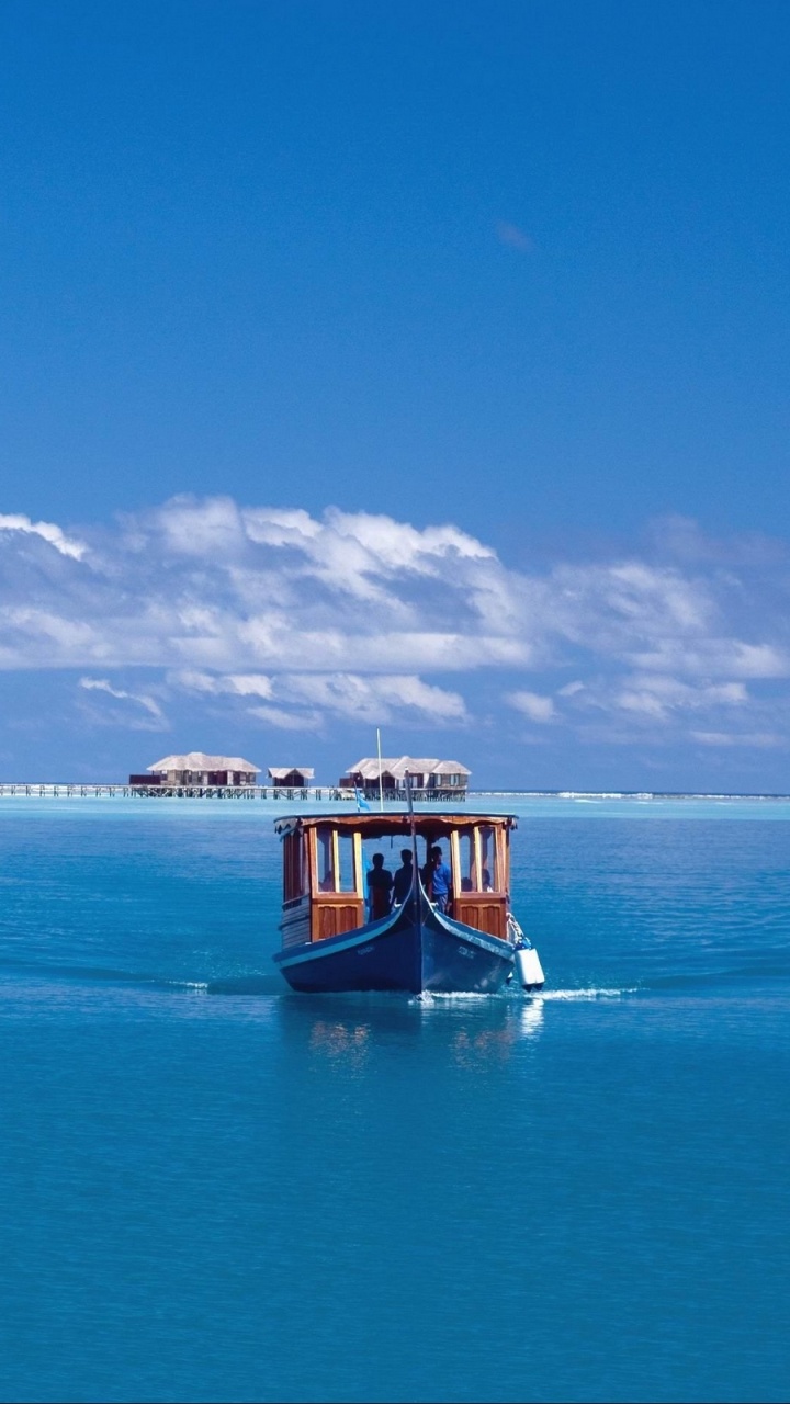 Brown Boat on Sea Under Blue Sky During Daytime. Wallpaper in 720x1280 Resolution