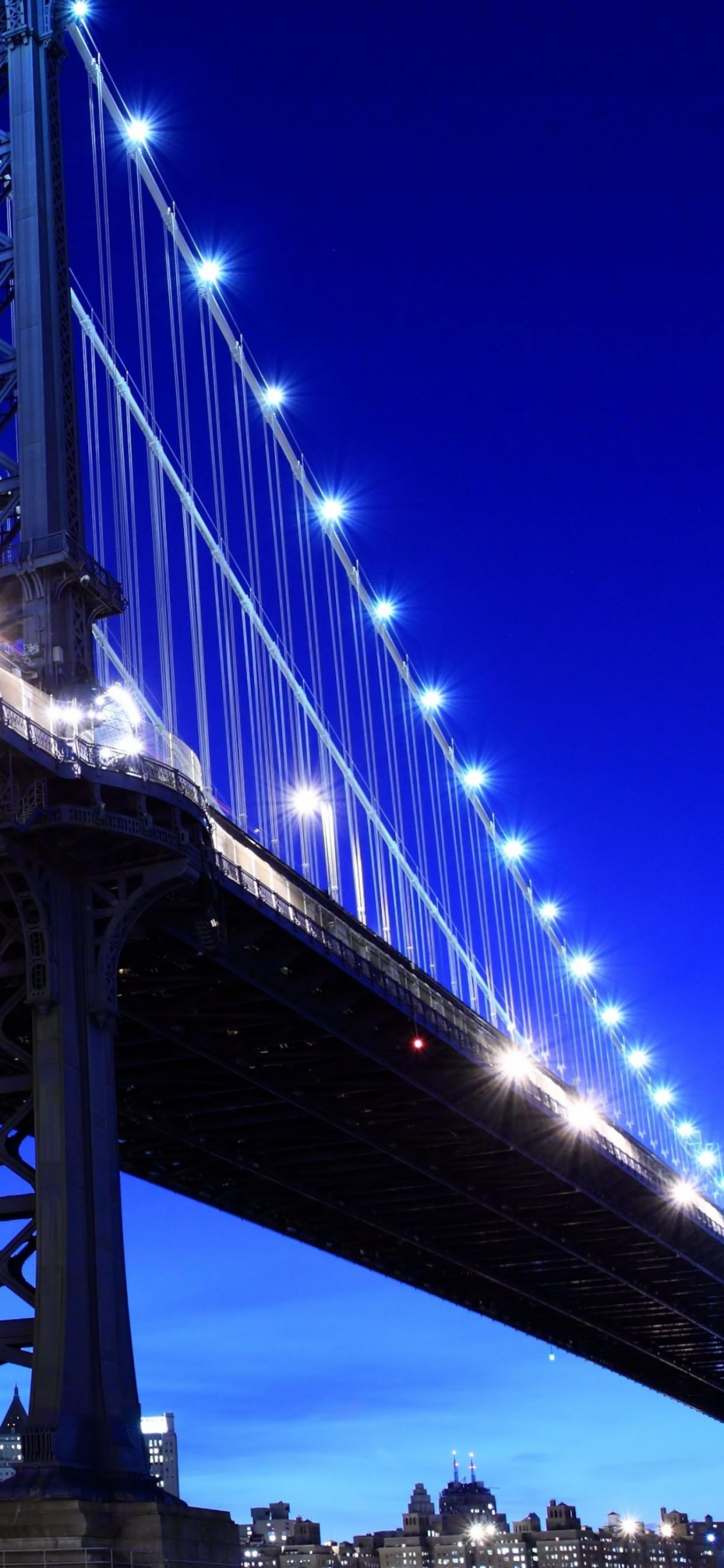 Pont Bleu Sous Ciel Bleu Pendant la Nuit. Wallpaper in 1125x2436 Resolution