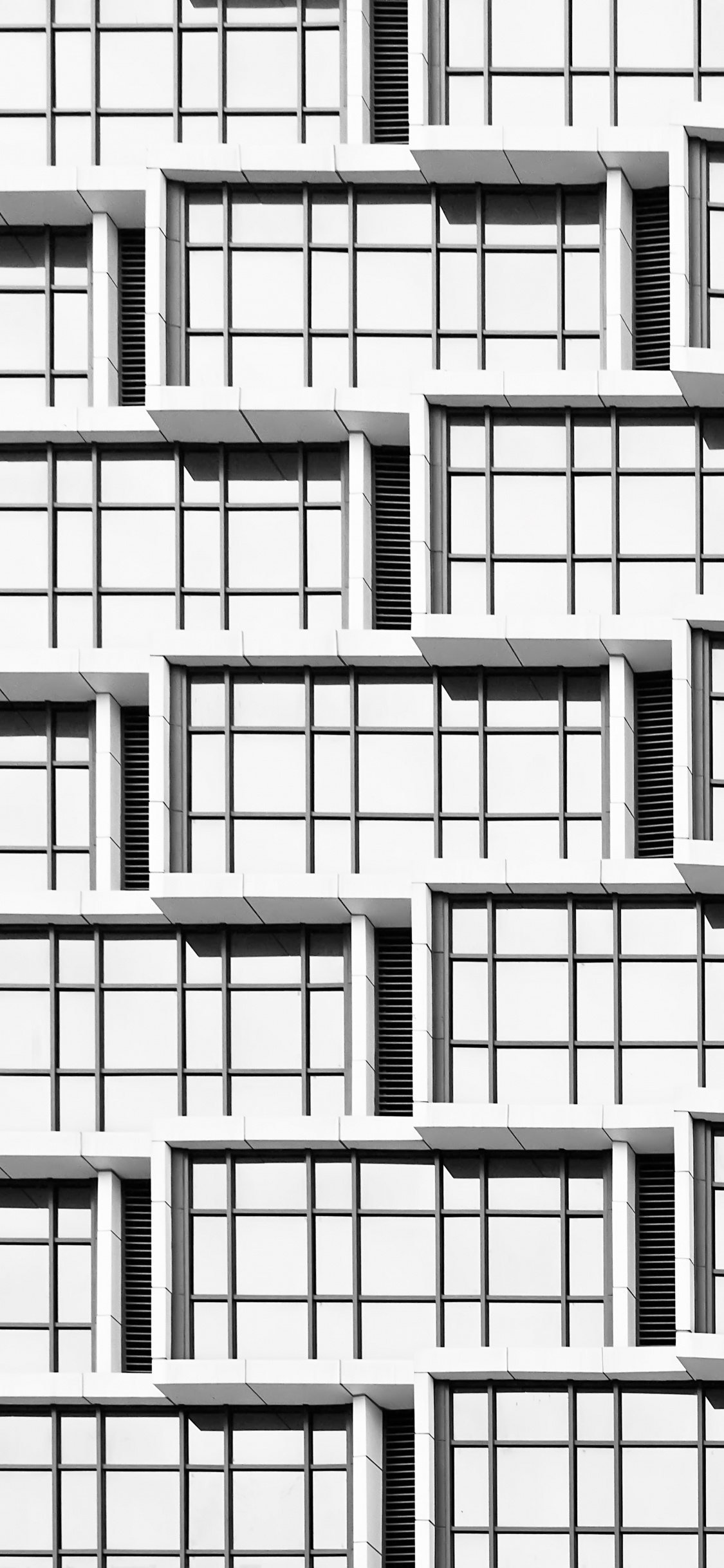 Weißes Betongebäude Tagsüber. Wallpaper in 1125x2436 Resolution