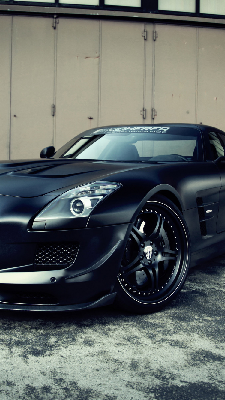 Black Bmw m 3 Coupe Parked Near White Wall. Wallpaper in 750x1334 Resolution