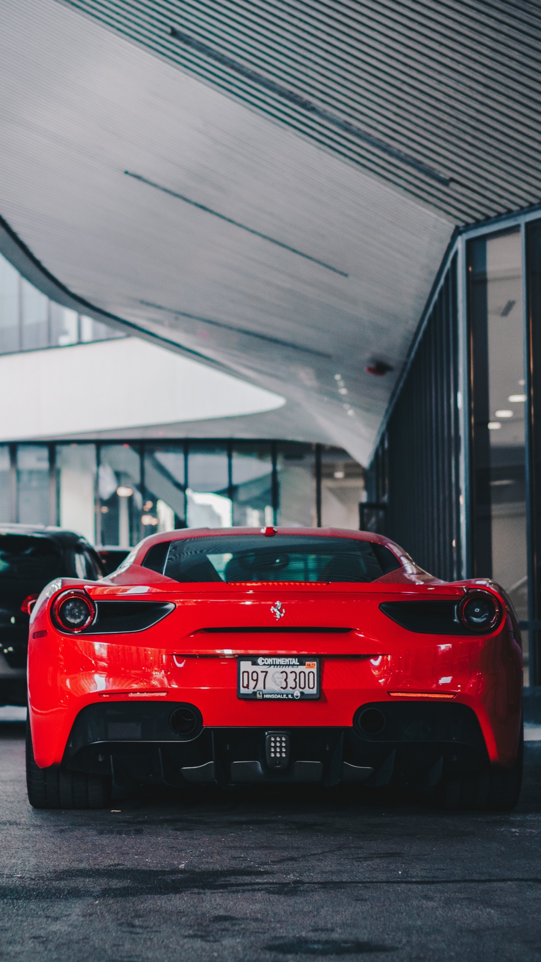 Red Ferrari Car Parked Near Building. Wallpaper in 1080x1920 Resolution