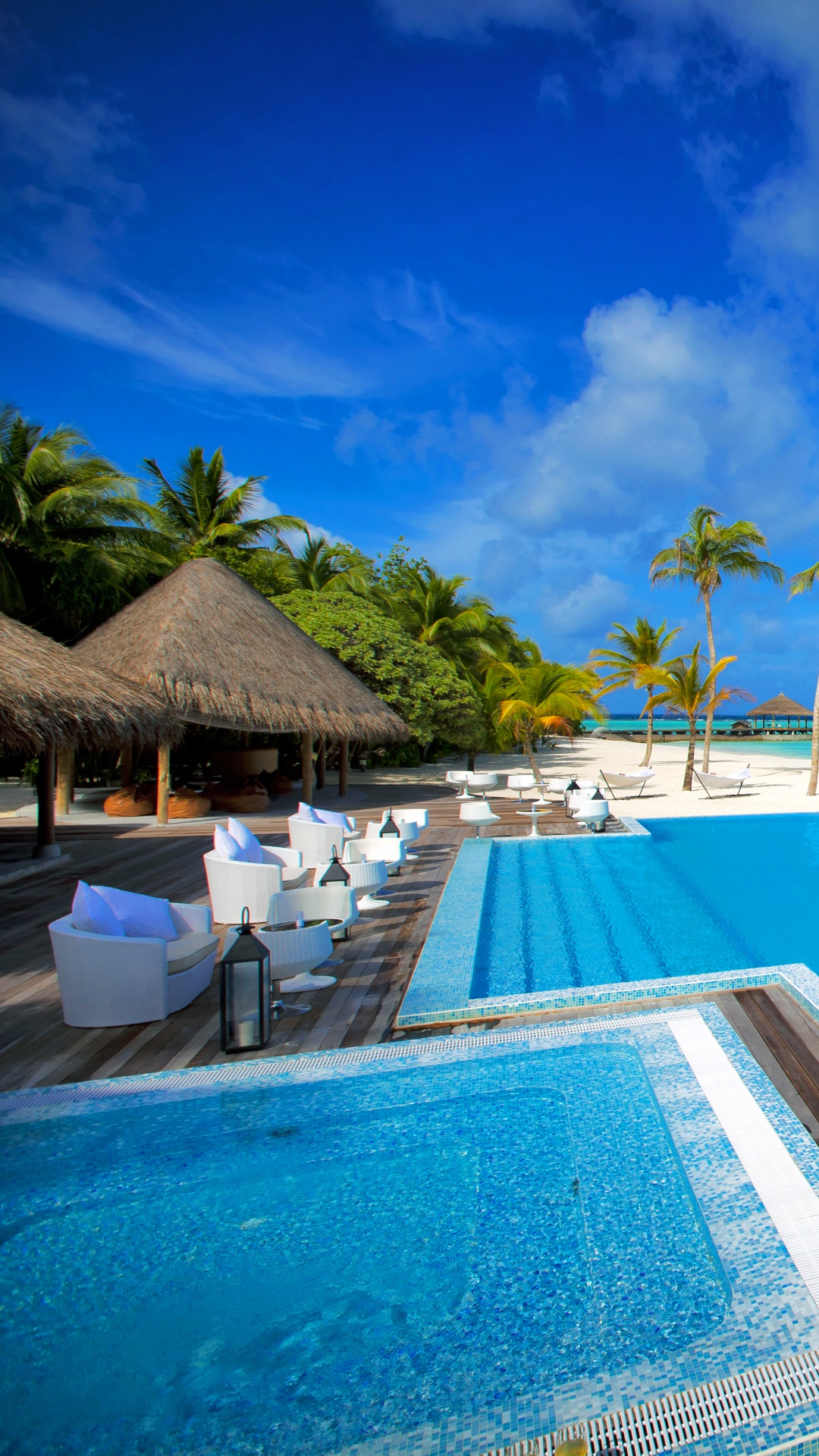 Brown Wooden Lounge Chairs on Blue Swimming Pool During Daytime. Wallpaper in 1080x1920 Resolution