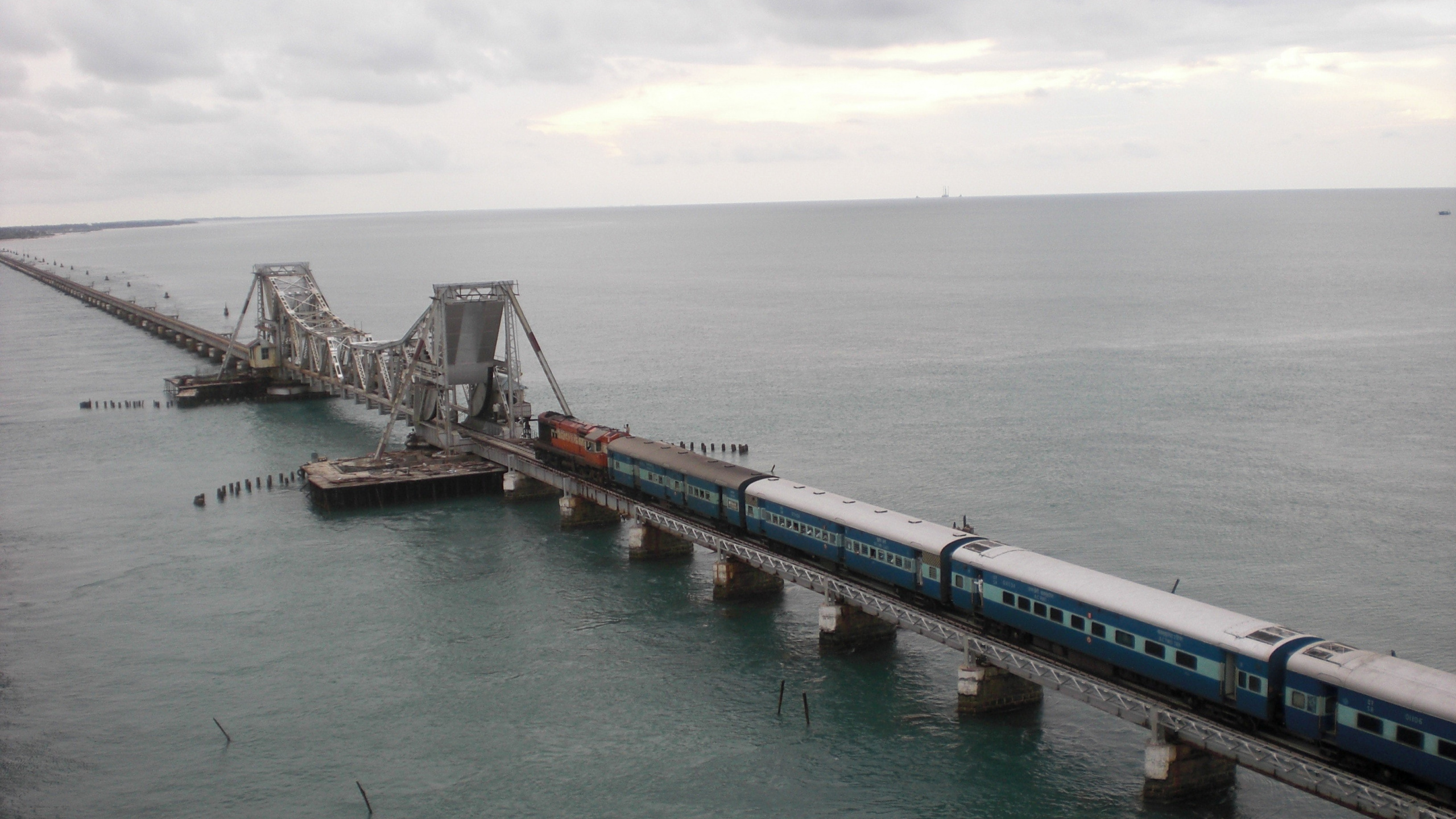 Brown Wooden Dock on Sea During Daytime. Wallpaper in 2560x1440 Resolution