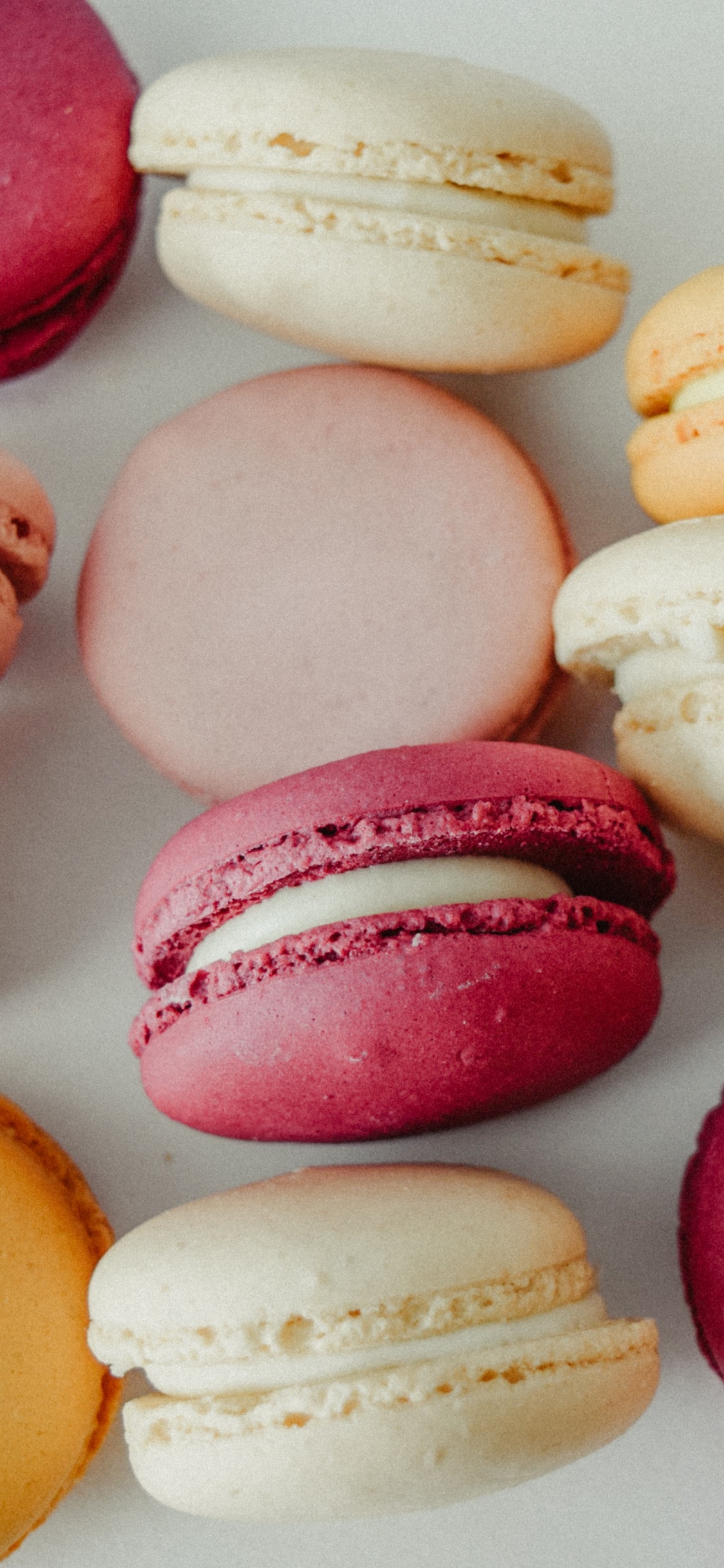Pink Yellow and White Macaroons. Wallpaper in 1125x2436 Resolution
