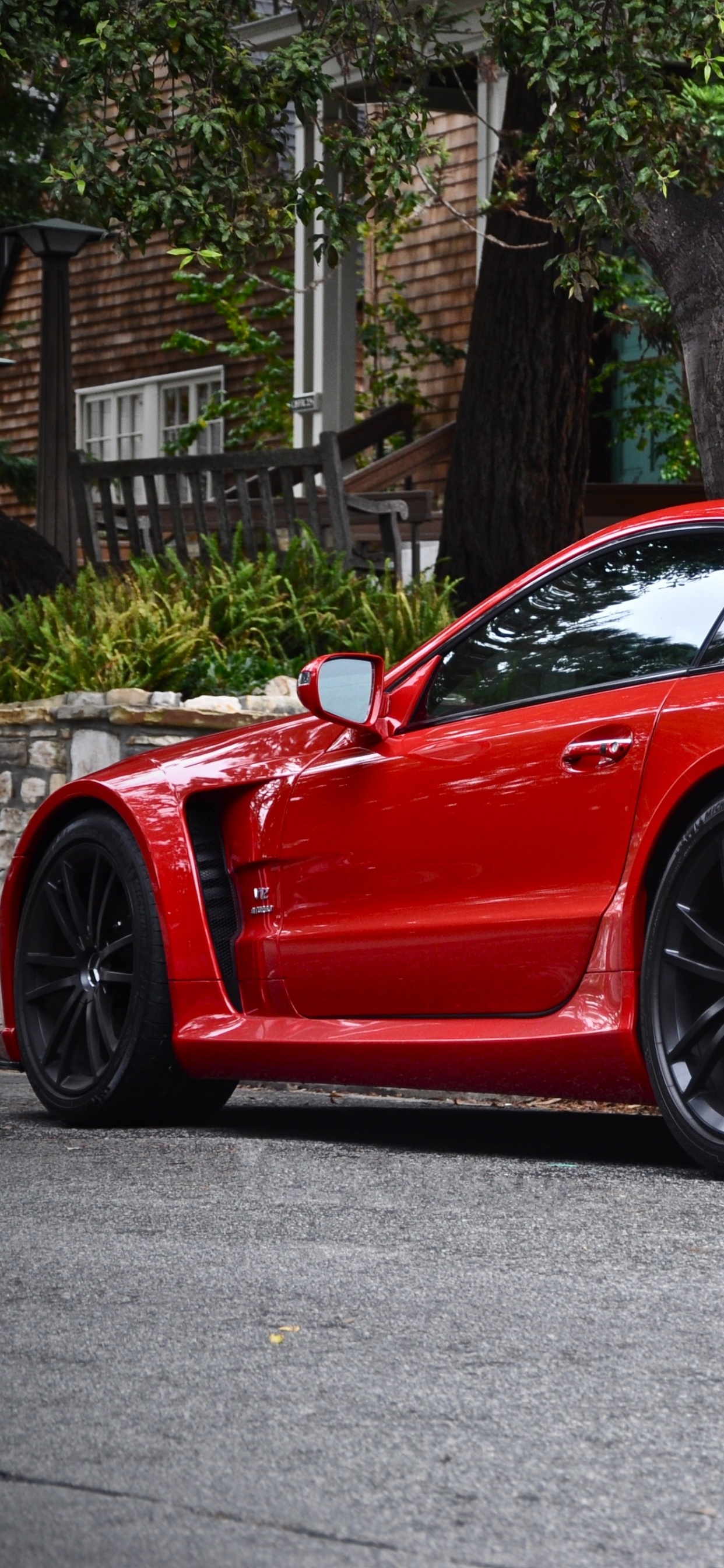 Red Ferrari 458 Italia Parked on Road Near Trees During Daytime. Wallpaper in 1242x2688 Resolution