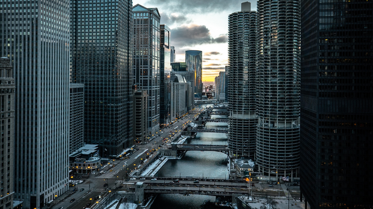 Cars on Road Between High Rise Buildings During Daytime. Wallpaper in 1280x720 Resolution