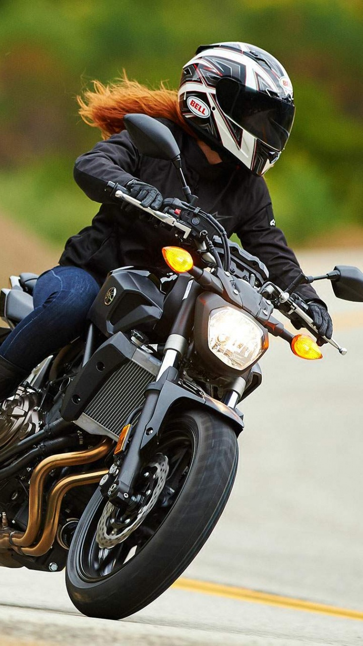 Man in Black Jacket Riding Motorcycle on Road During Daytime. Wallpaper in 720x1280 Resolution