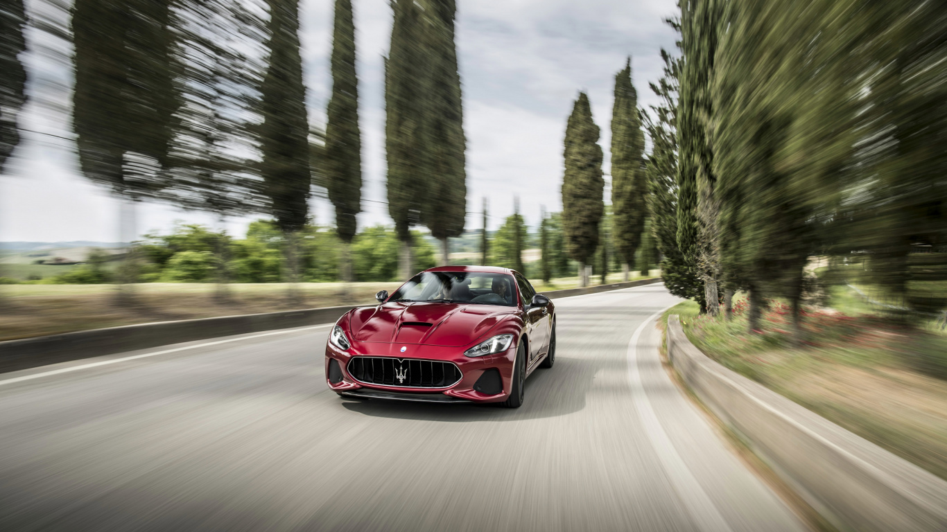 Roter Ferrari-Sportwagen Tagsüber Unterwegs. Wallpaper in 1366x768 Resolution