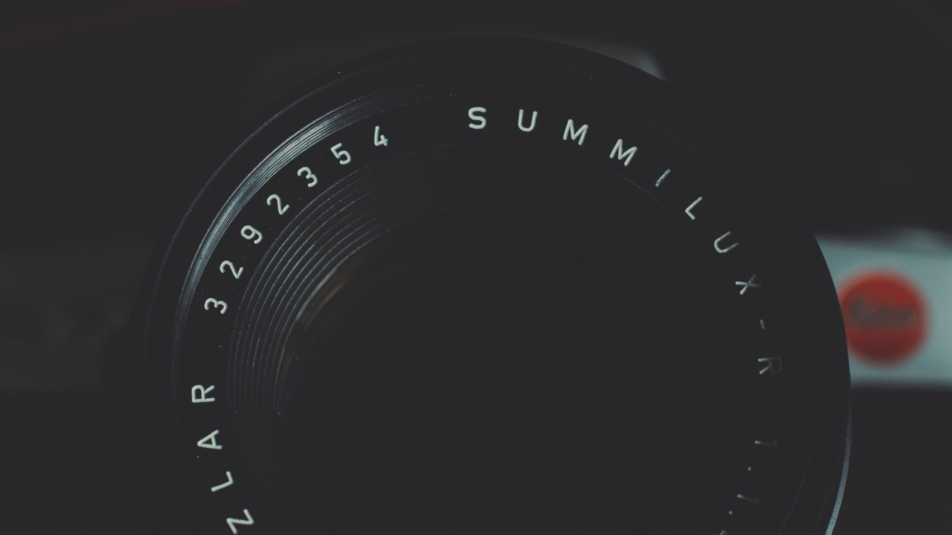 Black Camera Lens on Red and White Striped Textile. Wallpaper in 1920x1080 Resolution