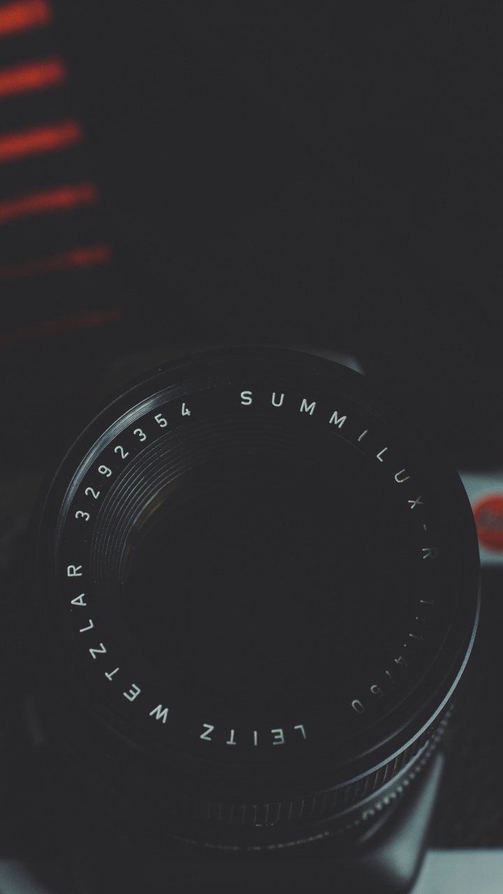 Black Camera Lens on Red and White Striped Textile. Wallpaper in 720x1280 Resolution