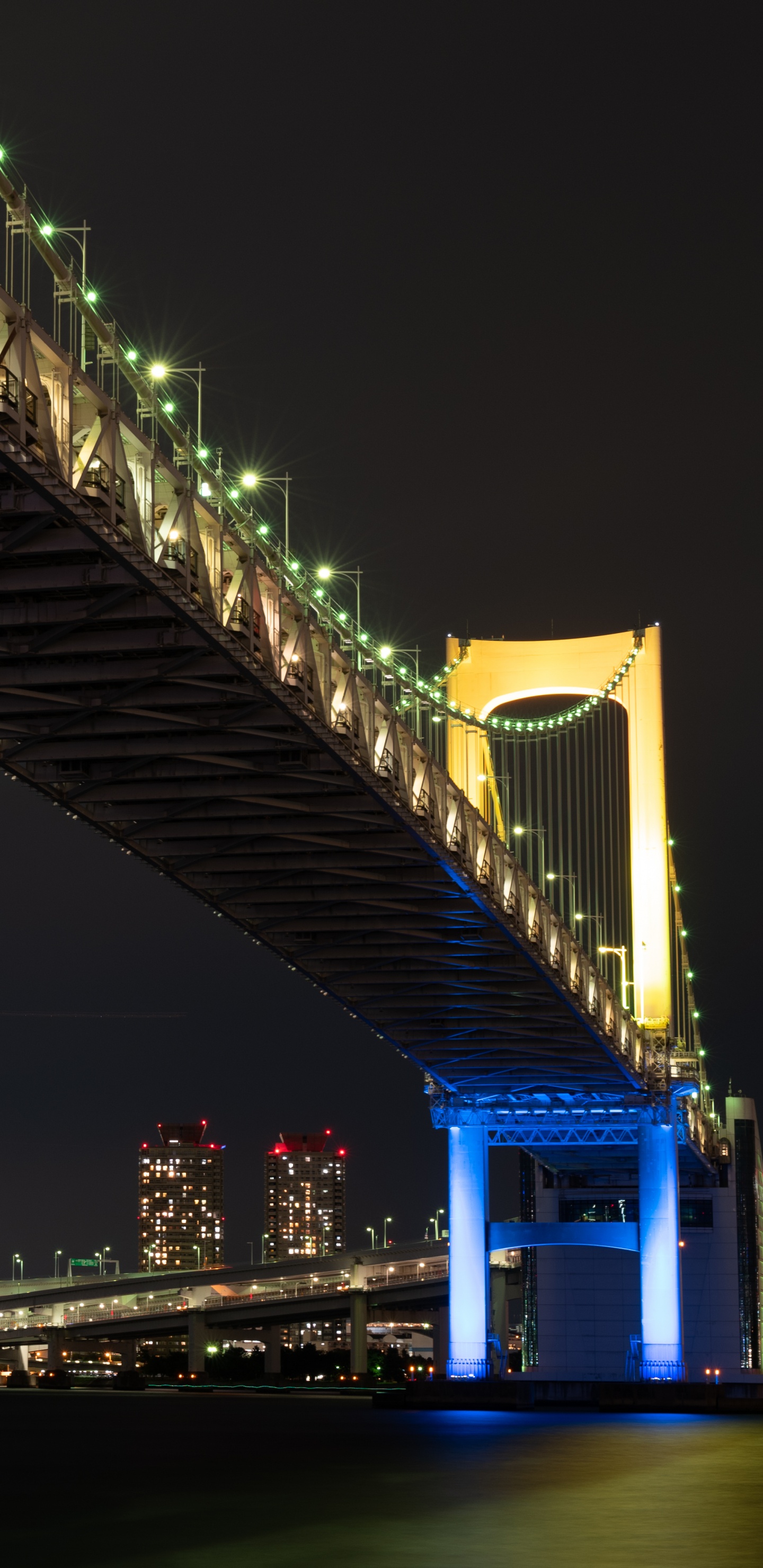 Blue Lighted Bridge During Night Time. Wallpaper in 1440x2960 Resolution