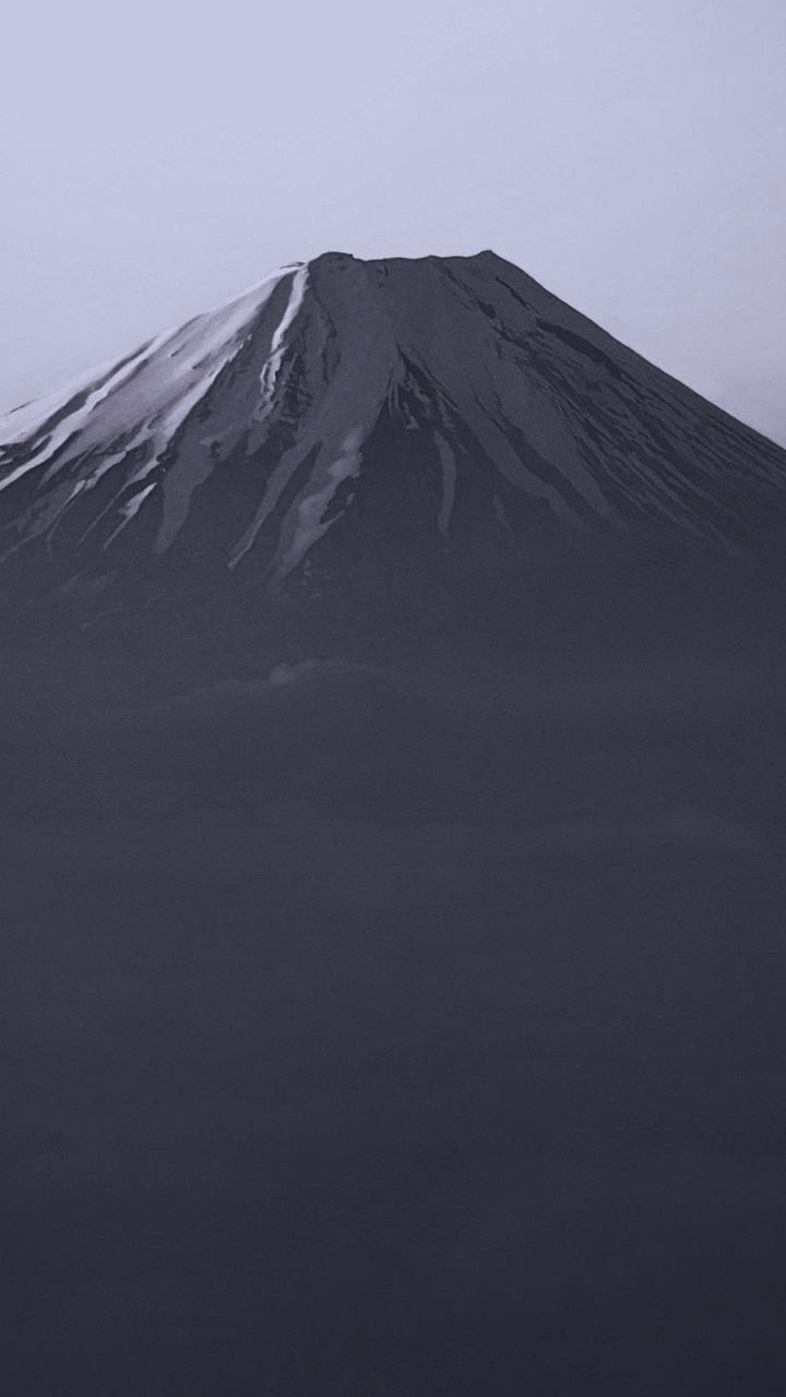Grayscale Photo of Mountain Under Cloudy Sky. Wallpaper in 720x1280 Resolution