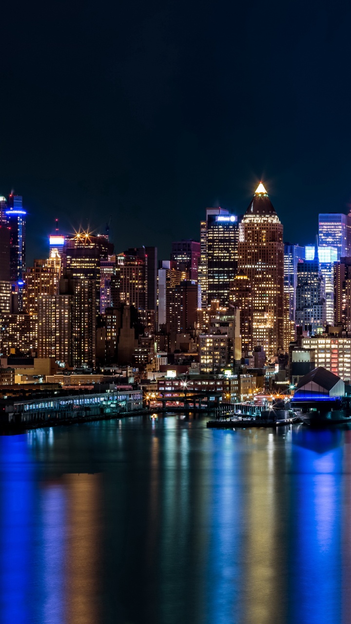 City Skyline During Night Time. Wallpaper in 720x1280 Resolution