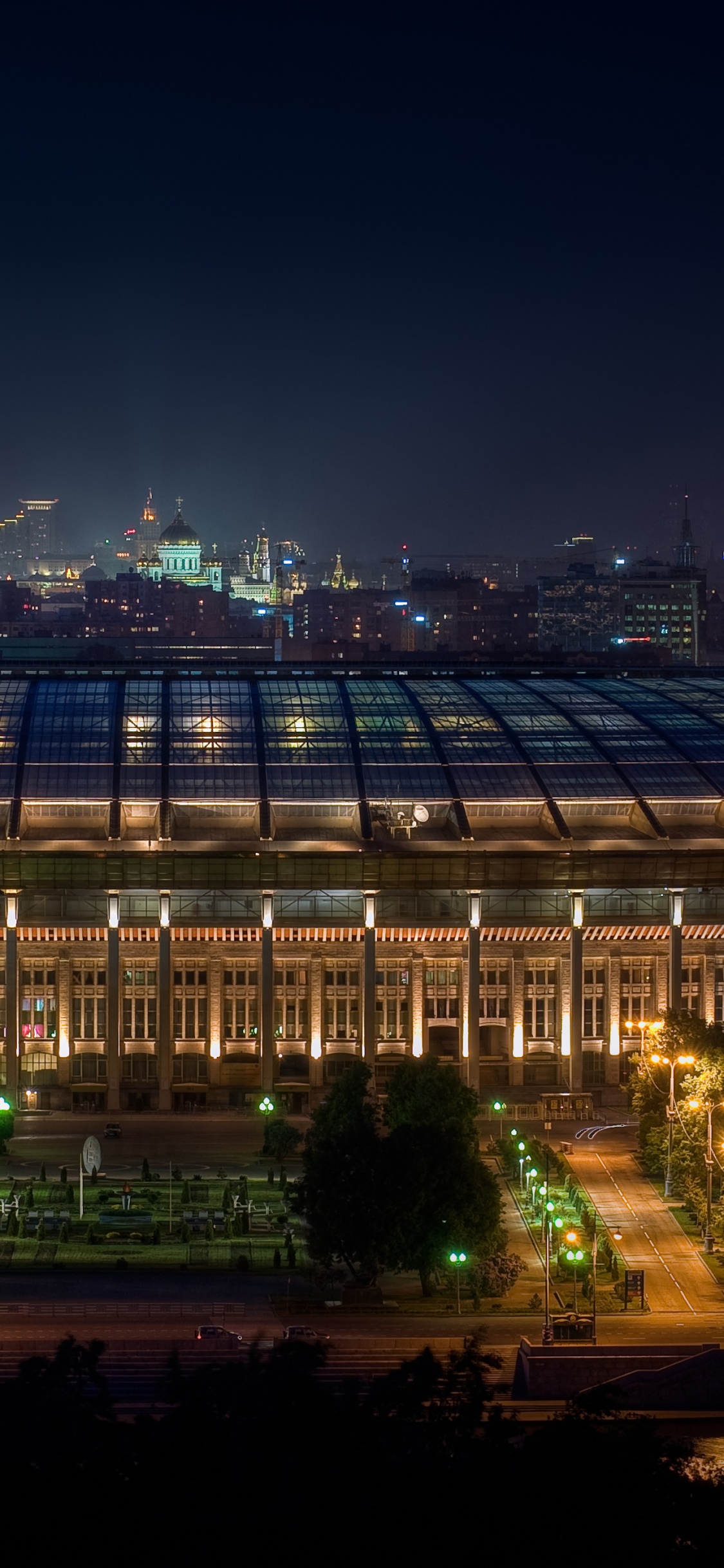 White and Black Building During Night Time. Wallpaper in 1125x2436 Resolution
