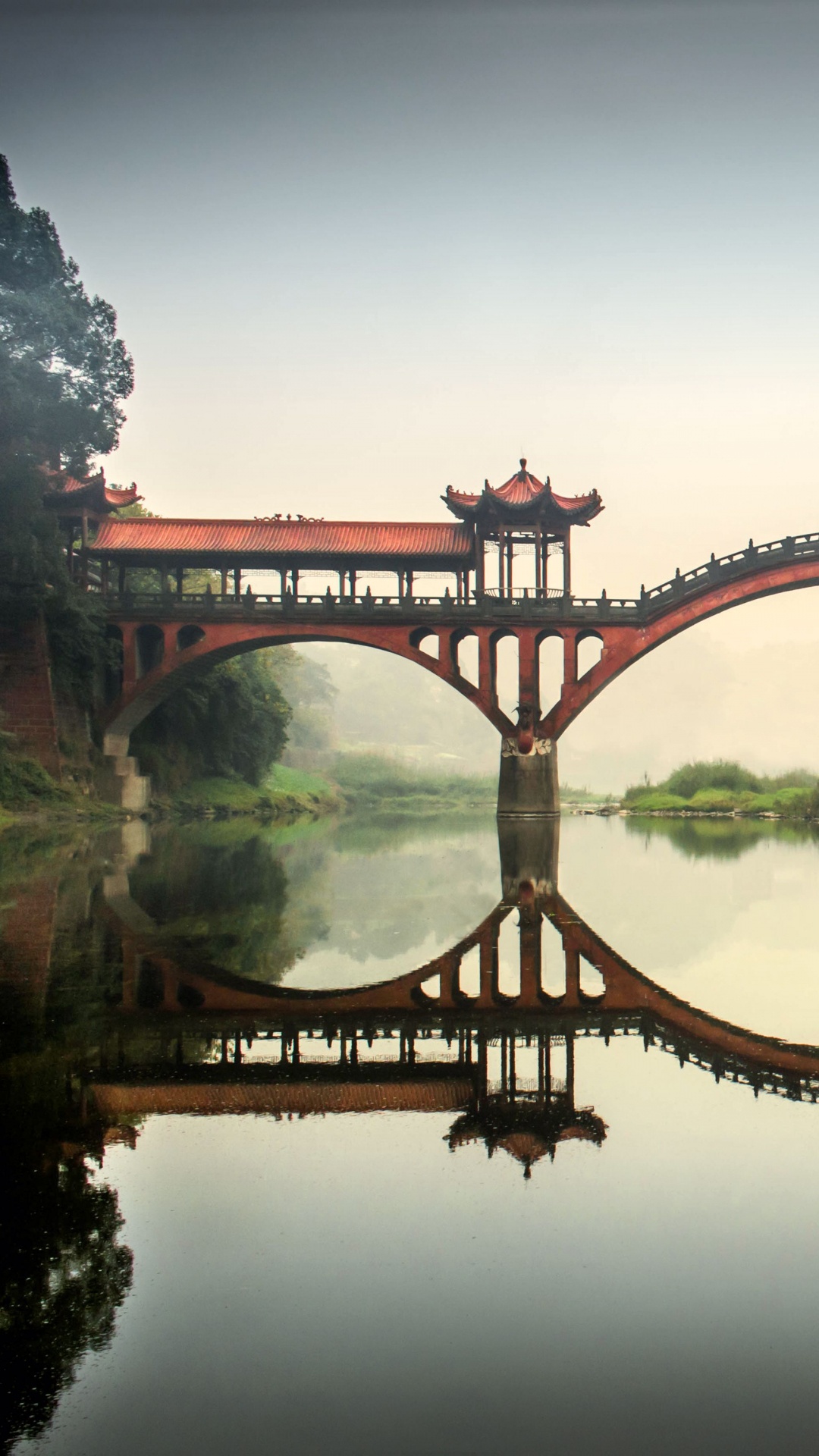 Brown Bridge Over Body of Water. Wallpaper in 1080x1920 Resolution