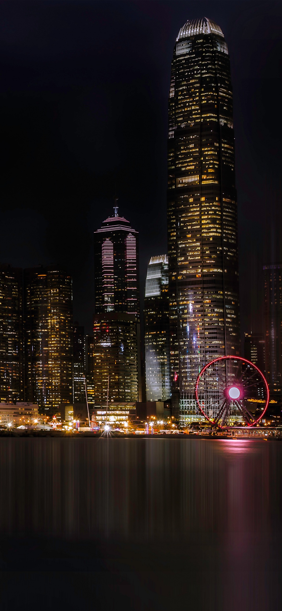 City Skyline During Night Time. Wallpaper in 1125x2436 Resolution