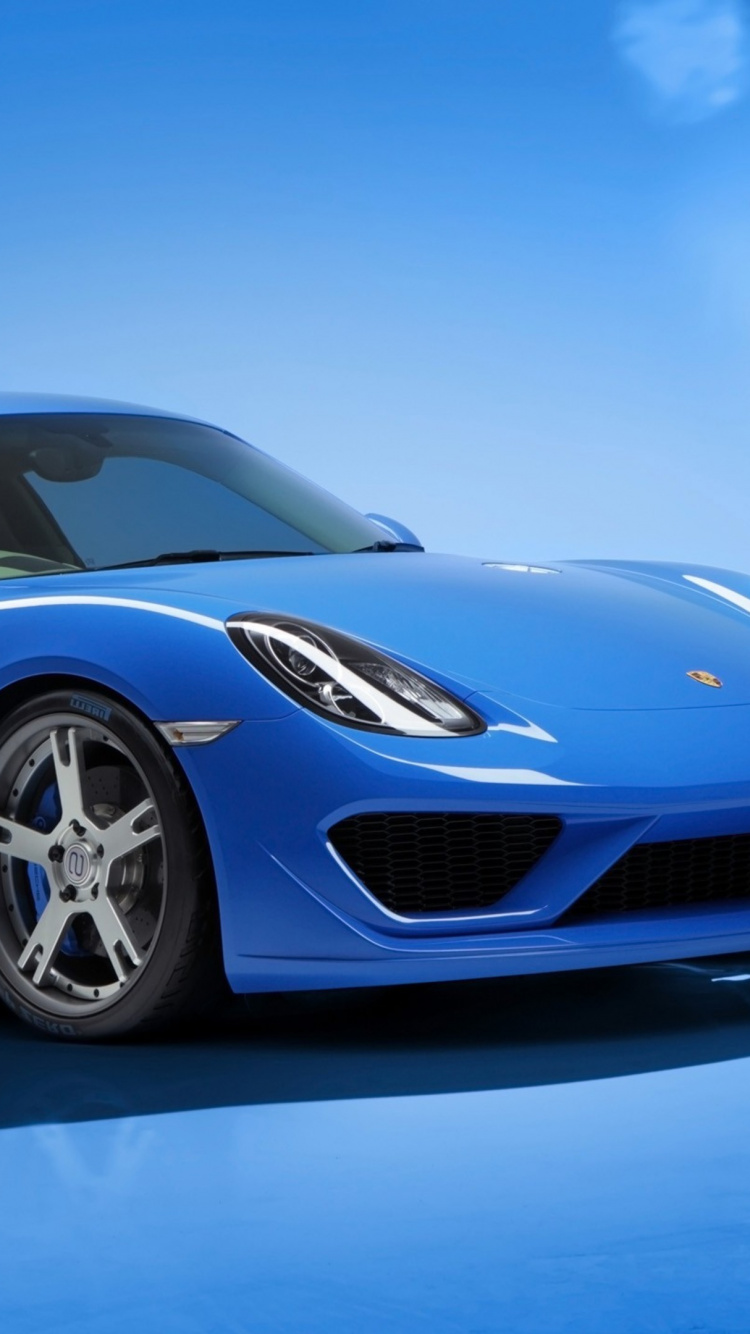 Blue Porsche 911 on Gray Pavement. Wallpaper in 750x1334 Resolution