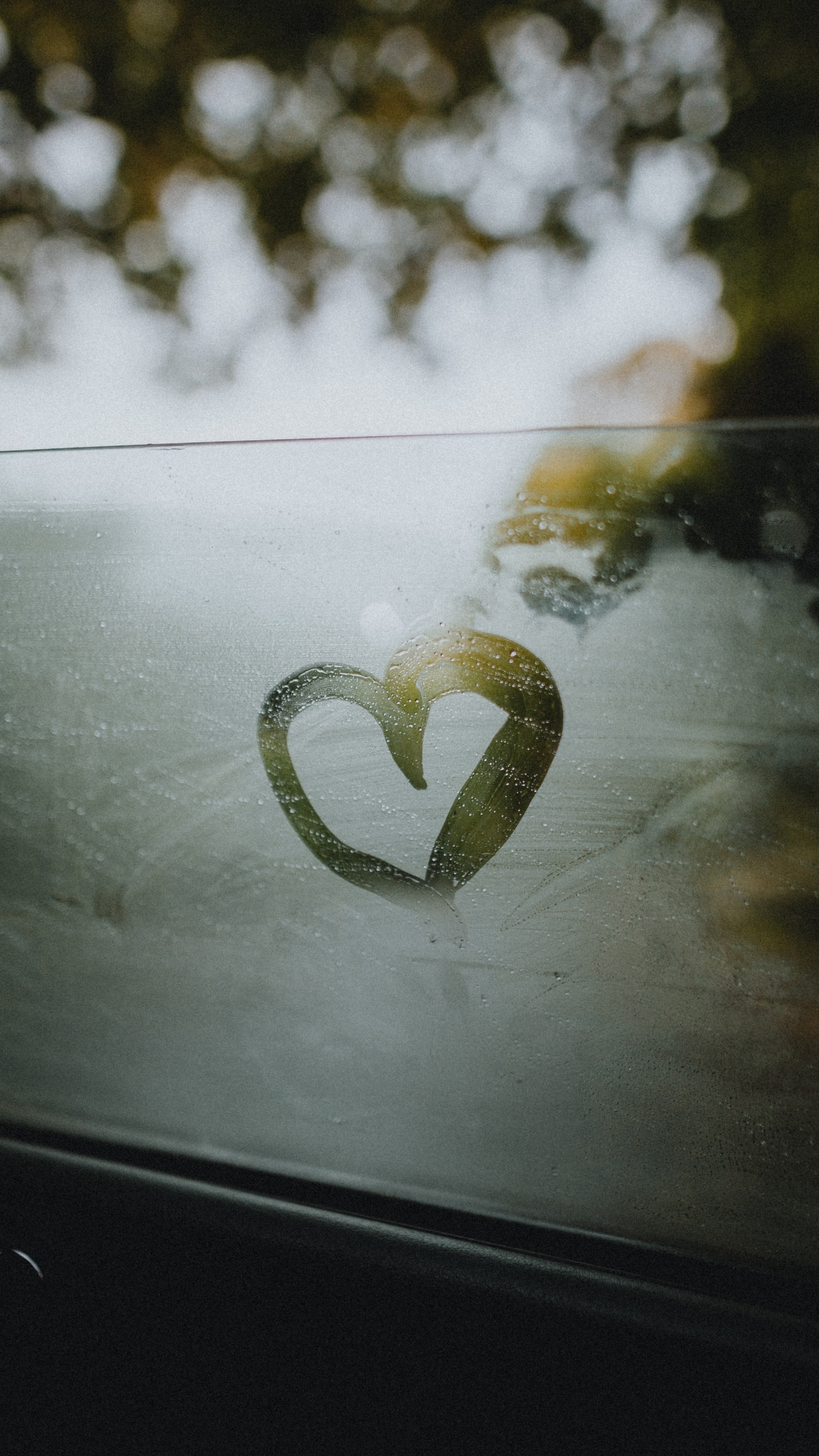 White Heart Shaped Ornament on Black Surface. Wallpaper in 1440x2560 Resolution