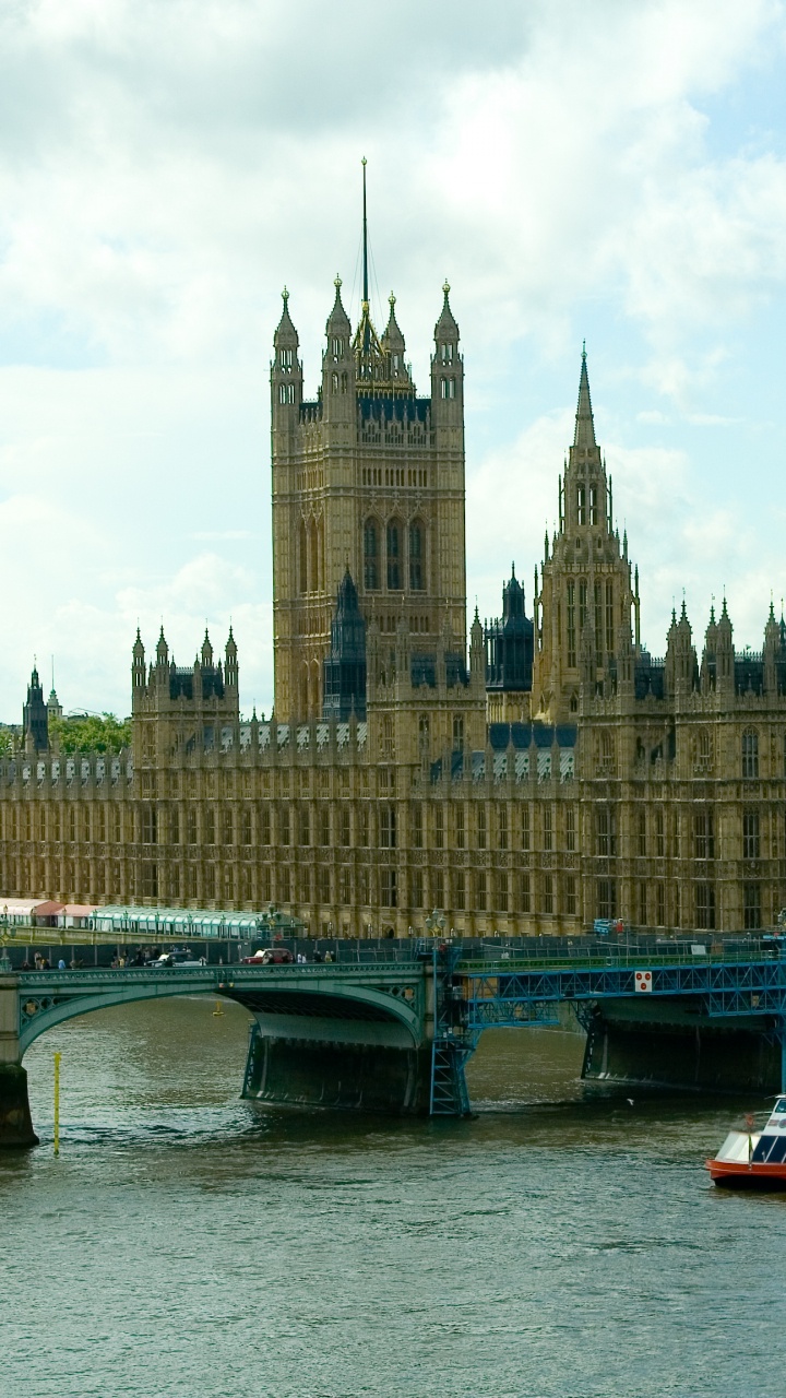 White and Red Boat on Water Near Brown Concrete Building During Daytime. Wallpaper in 720x1280 Resolution