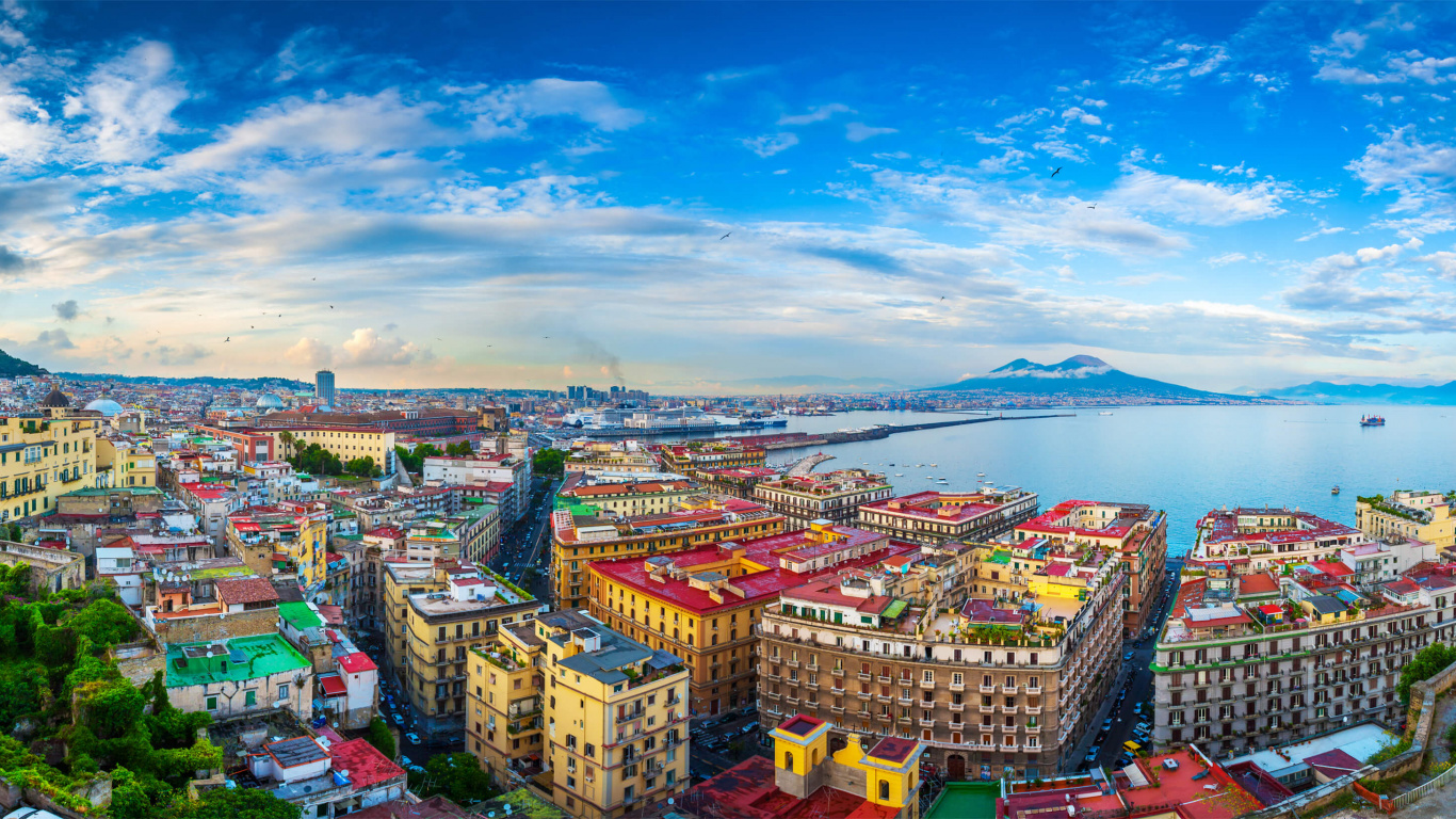Vista Aérea de Los Edificios de la Ciudad Cerca Del Cuerpo de Agua Durante el Día.. Wallpaper in 1366x768 Resolution