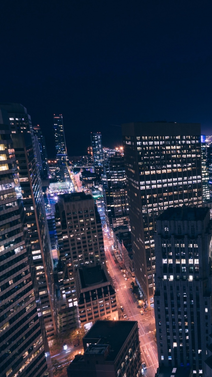 City With High Rise Buildings During Night Time. Wallpaper in 720x1280 Resolution