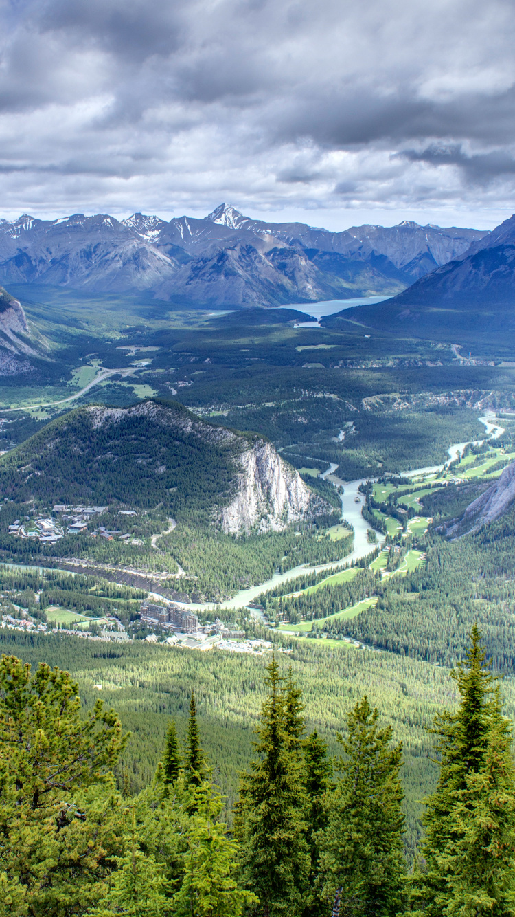 Green Trees and Mountains Under White Clouds and Blue Sky During Daytime. Wallpaper in 750x1334 Resolution