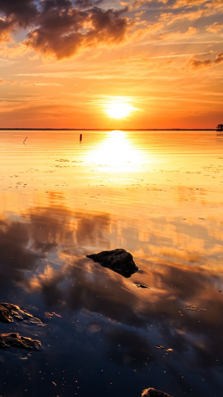 Brown Wooden Dock on Body of Water During Sunset. Wallpaper in 720x1280 Resolution