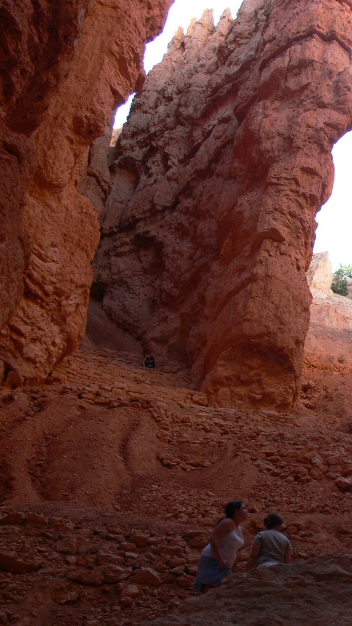 People Walking on Brown Rock Formation During Daytime. Wallpaper in 720x1280 Resolution
