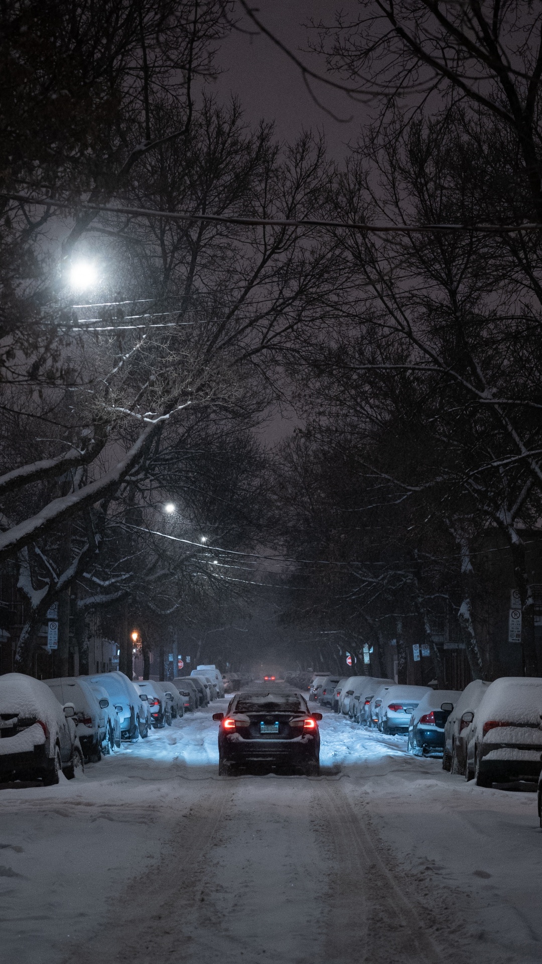 Cars Parked on Snow Covered Road During Night Time. Wallpaper in 1080x1920 Resolution