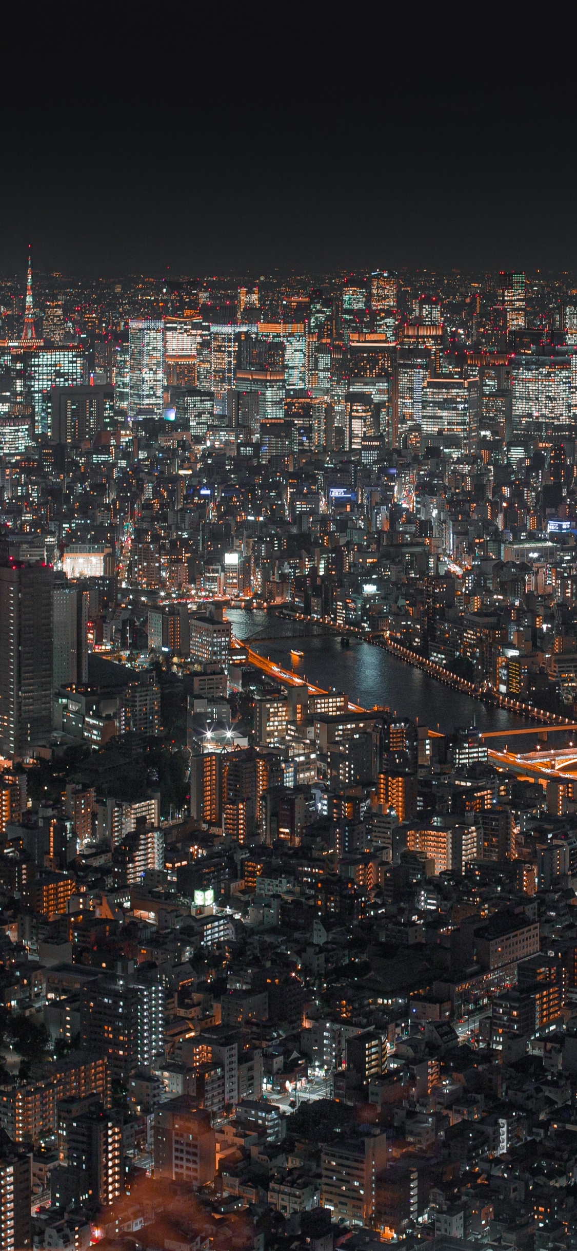 Vista Aérea de la Ciudad Durante la Noche.. Wallpaper in 1125x2436 Resolution