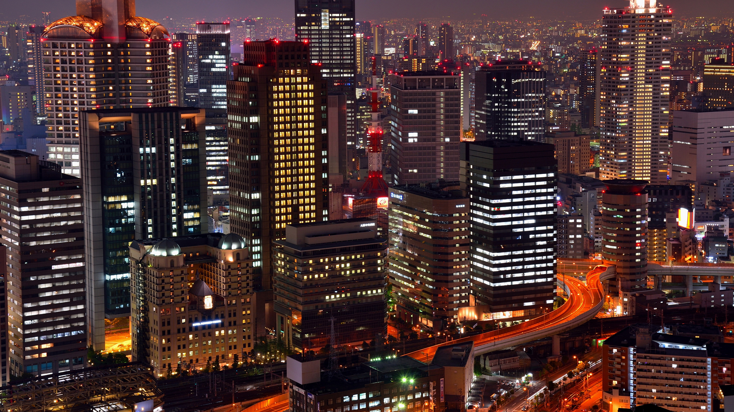 City Buildings During Night Time. Wallpaper in 2560x1440 Resolution