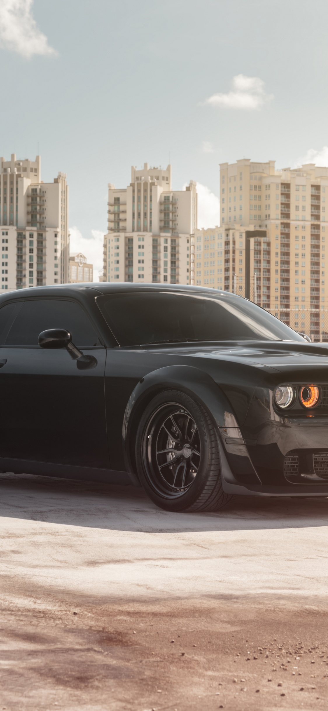 Black Coupe Parked on Gray Concrete Pavement During Daytime. Wallpaper in 1125x2436 Resolution