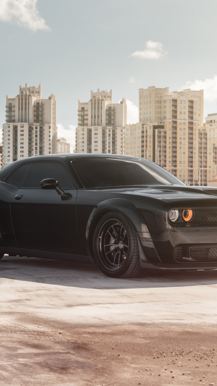 Black Coupe Parked on Gray Concrete Pavement During Daytime. Wallpaper in 750x1334 Resolution