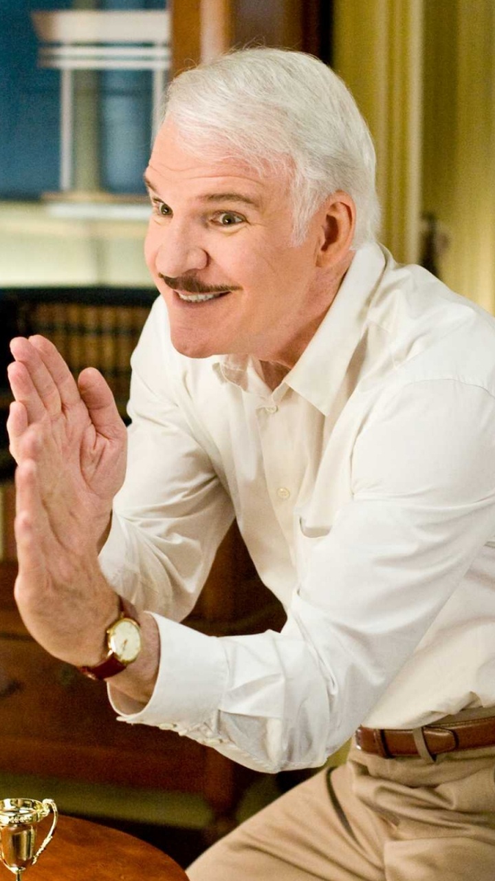Man in White Dress Shirt and Brown Pants Sitting on Chair. Wallpaper in 720x1280 Resolution