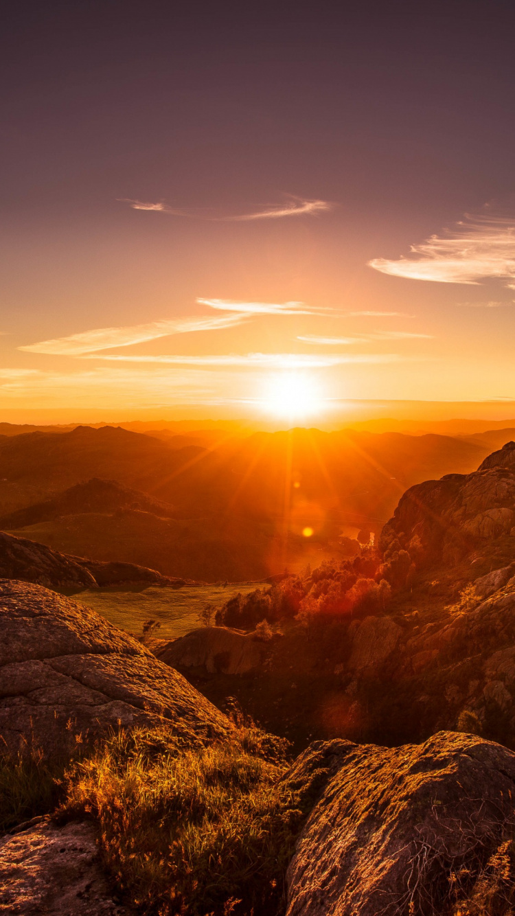 Brown Rocky Mountain During Sunset. Wallpaper in 750x1334 Resolution