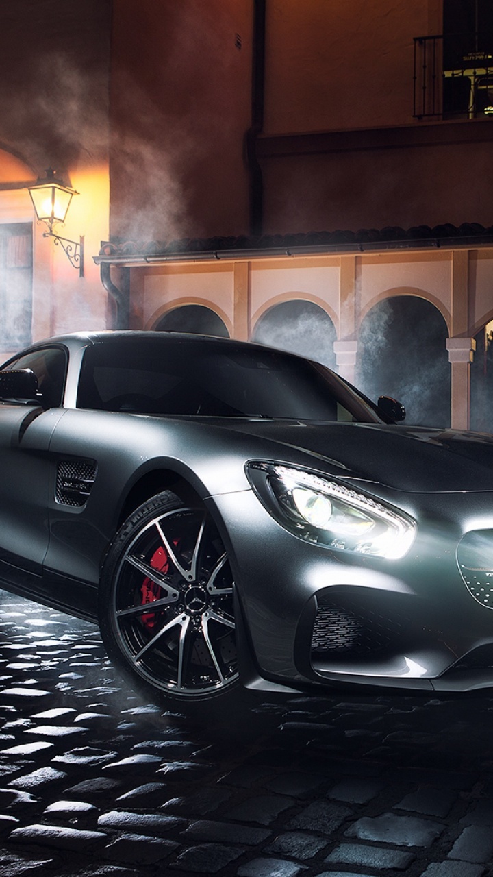 Porsche 911 Negro Estacionado Cerca Del Edificio de Hormigón Marrón Durante la Noche. Wallpaper in 720x1280 Resolution