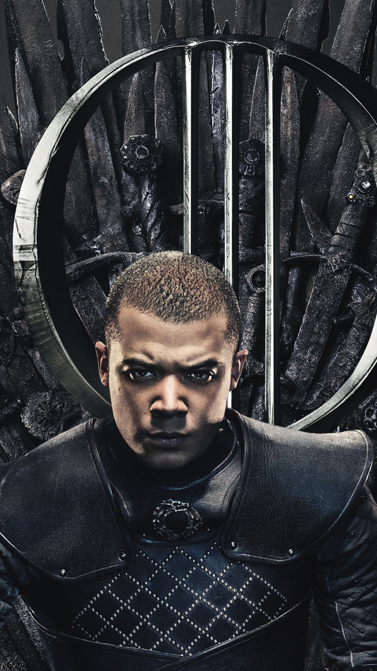 Mann in Schwarzer Lederjacke Steht Neben Schwarzem Metallrahmen. Wallpaper in 750x1334 Resolution