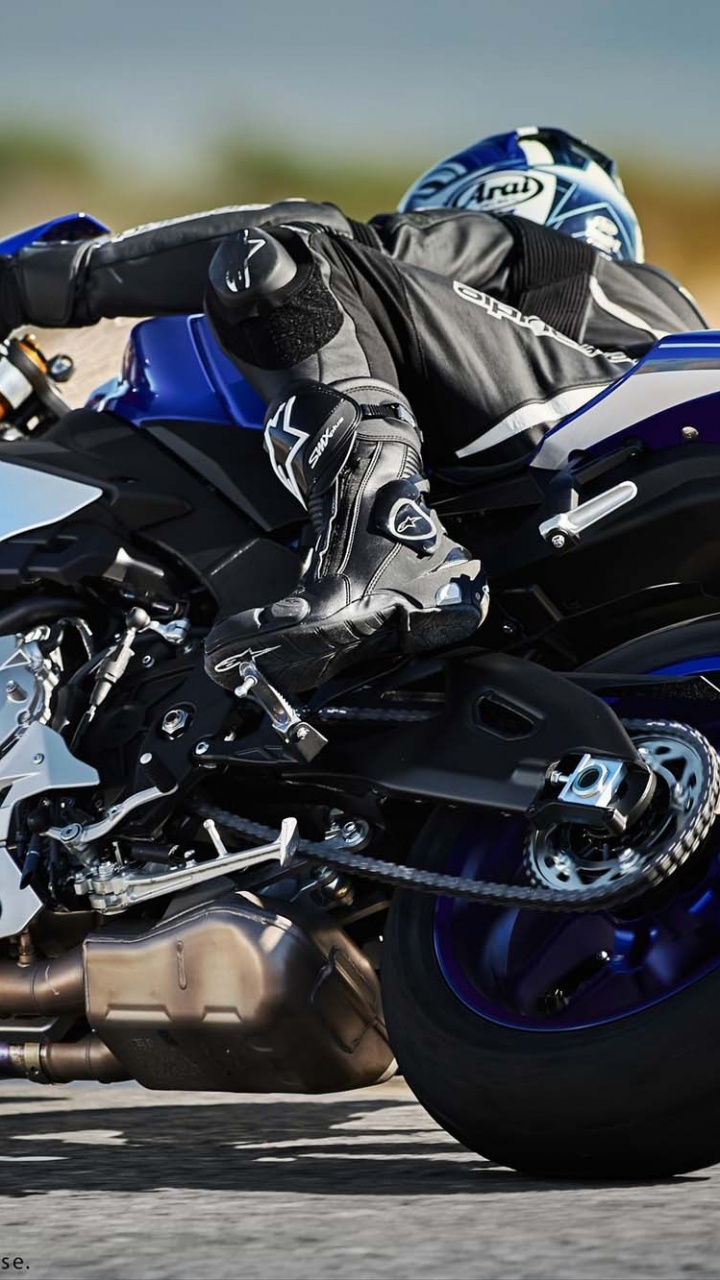 Man in Black and White Jacket Riding Blue and White Sports Bike. Wallpaper in 720x1280 Resolution