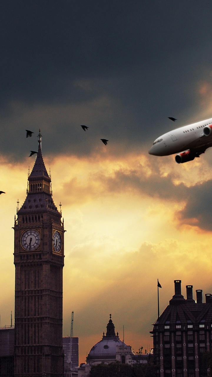 White and Red Airplane Flying Over The City During Sunset. Wallpaper in 720x1280 Resolution