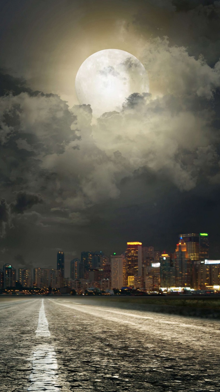 Horizonte de la Ciudad Con Luces Encendidas Durante la Noche. Wallpaper in 720x1280 Resolution